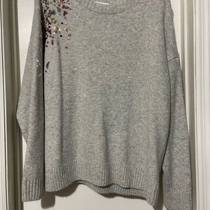 Gray sweater with sequin detail on shoulder